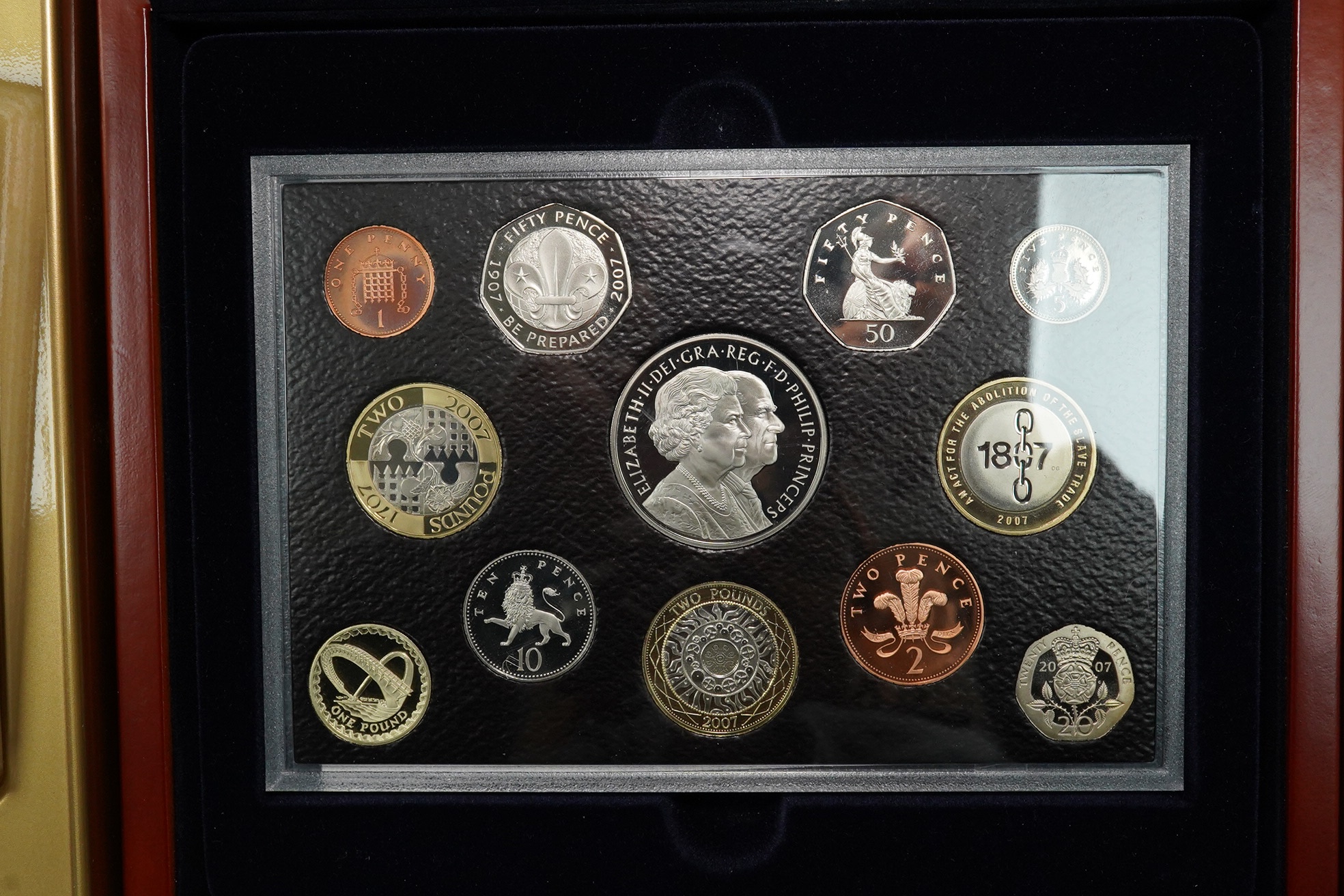 Royal Mint UK QEII coins, four executive proof coin sets, 2002 & 2003 in Golden Jubilee cases with certificates, 2007 & 2008, in wood cases of issue with certificates